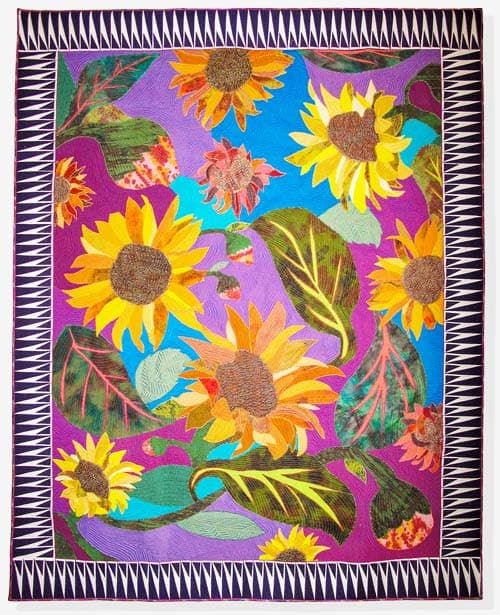 Artwork Sunflower Sambal - A tribute to the magnificent display of sunflowers in a neighbour’s garden. I wanted to highlight the range of colours I remembered in this yearly display. Techniques: Machine appliqué, Machine quilted, cording.