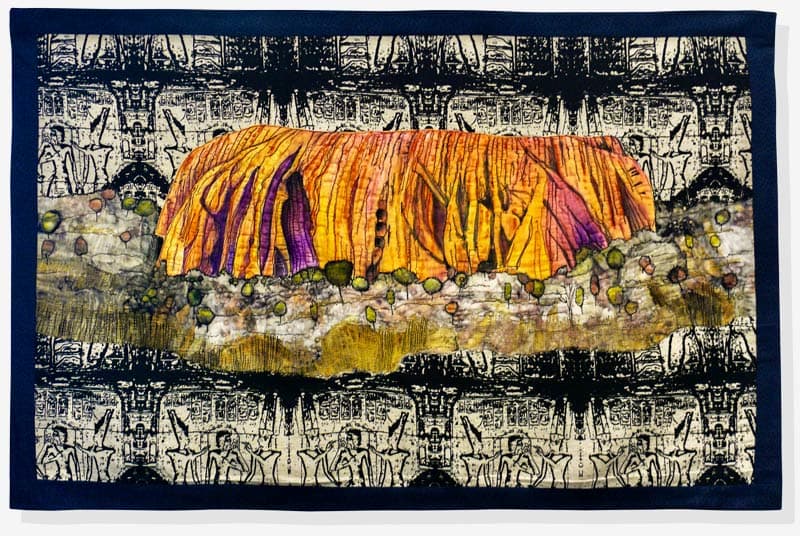 Artwork Australia The Worlds Oldest Civilization - Hand painted calico using Derwent Intense Pencils and free motion Stitching to emphasise the Uluru rock in Australia At the center of the artwork. Silk lining fabric from old kimino, dyed and printed with Eucalyptus leaves and rusty Iron, then free motion stitched and some painted details added to the trees. Used had background fabric, Egyptian Hieroglyphs hand-screen panel in black.